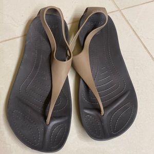 Brown with tan Crocs sandals